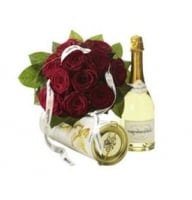 Sweet Bouquet of red roses and bottle of sparkling wine